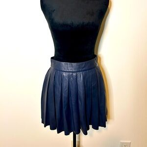 100% Lamb Leather
Skirt measures approx 15” in length
Center back zipper